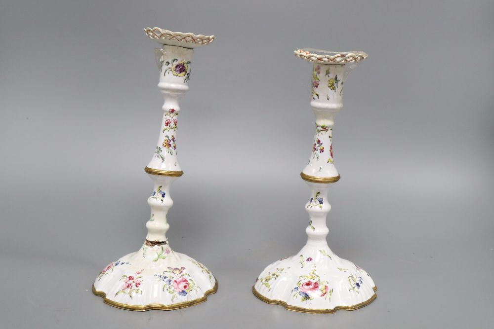 A pair of late 18th century South Staffordshire enamelled candlesticks, height 24cm